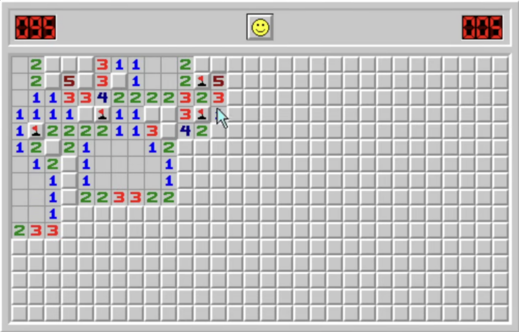 Screenshot von Minesweeper im klassischen Windows-Stil mit grauem Spielfeld, farbigen Zahlen, markierten Minen und Smiley-Button oben.